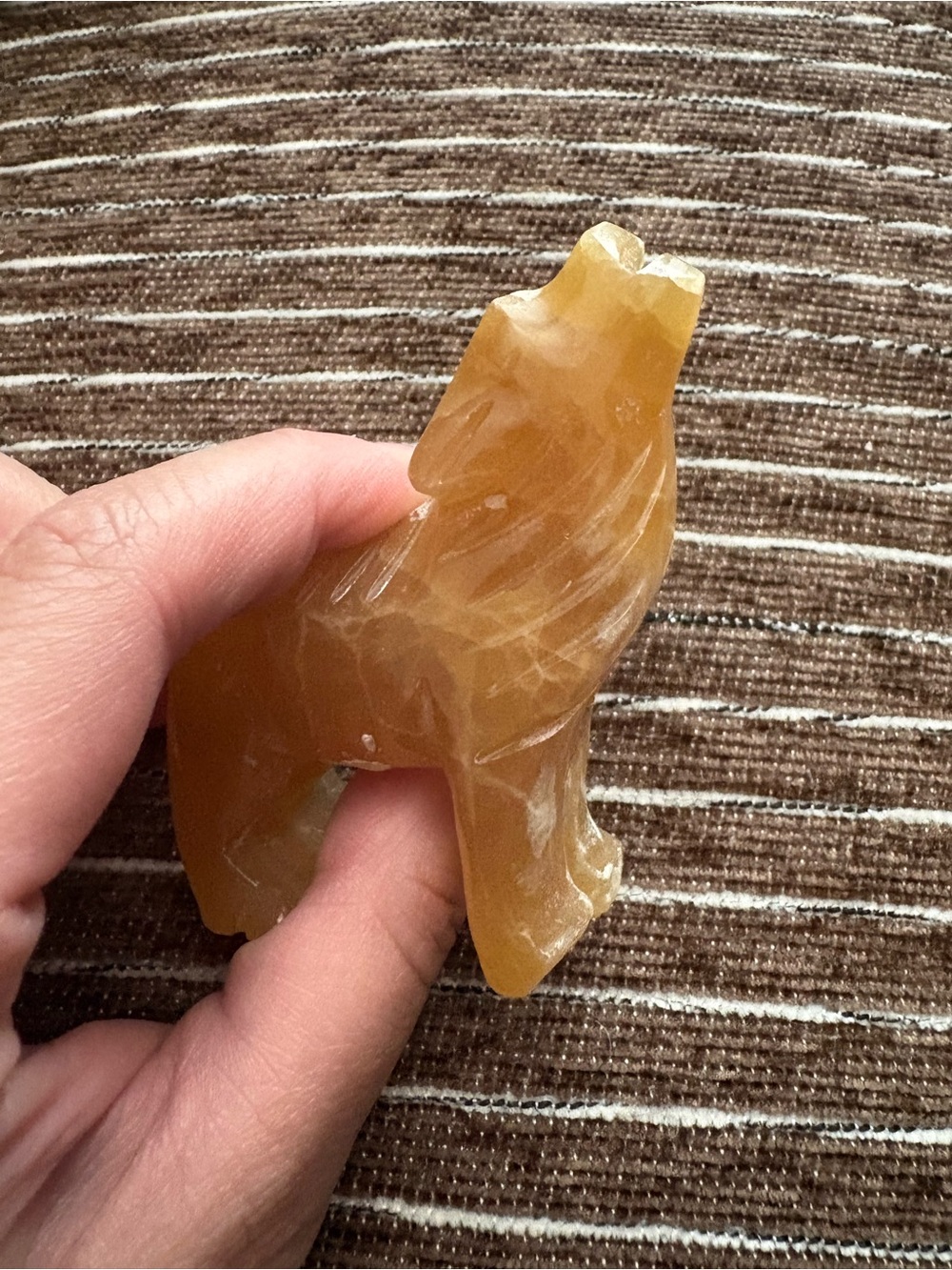 Honey calcite wolf crystal carving